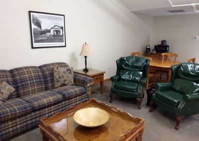 Book a spacious suite at the Damascus Old Mill Inn with a comfy living room area.